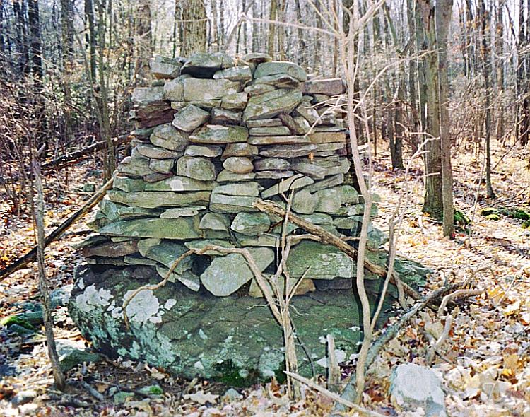 Here's a picture of a cairn from a cairn field similar to and not far from the one destroyed at Bartonsville. 

I have a lot of cairn pictures from up in the Poconos (Monroe County, PA), nearly all from the cairn field this one was in.
 
Thanks for posting that article.
 
Aluta