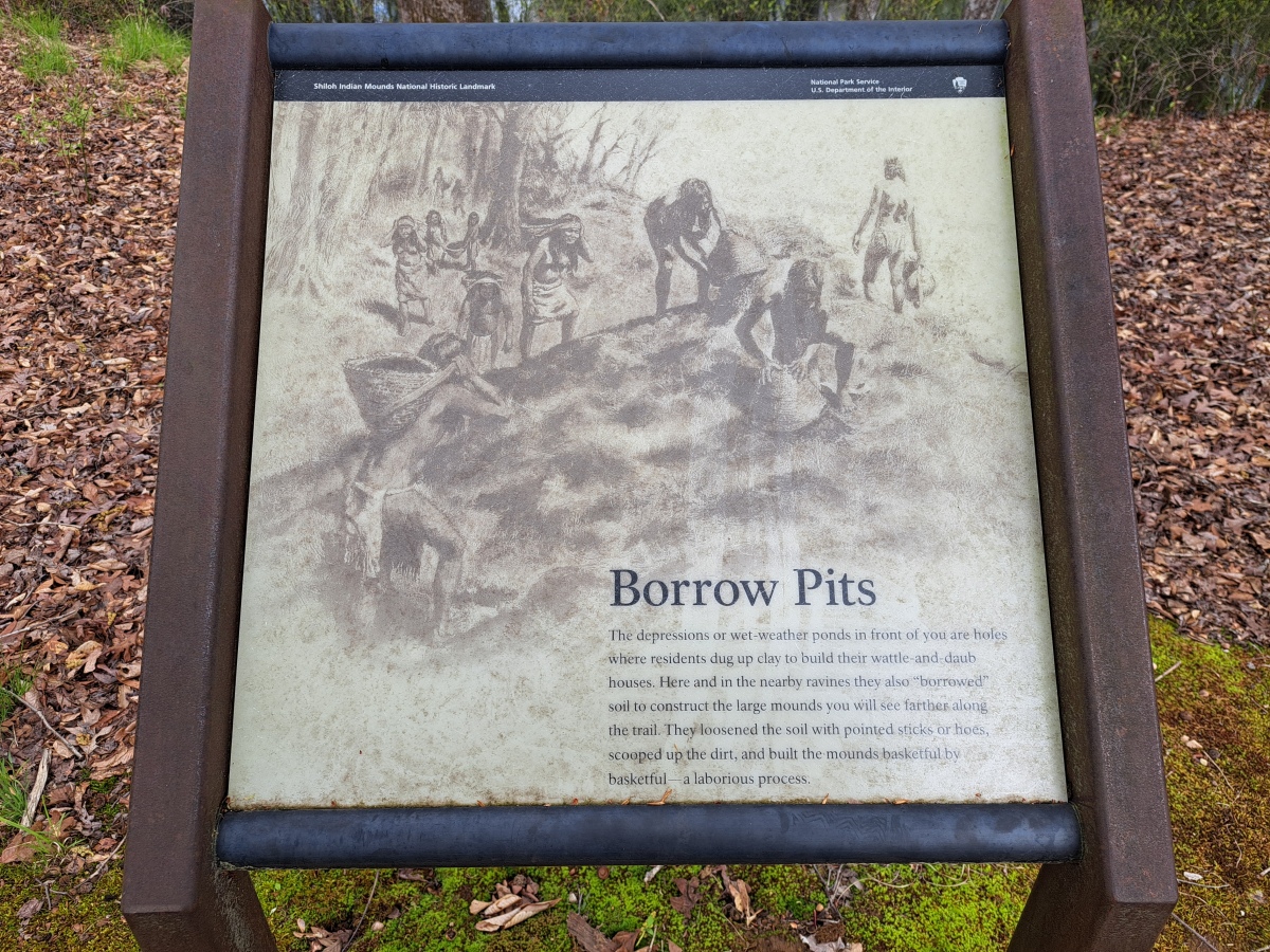 Interpretive sign describing borrow pits
