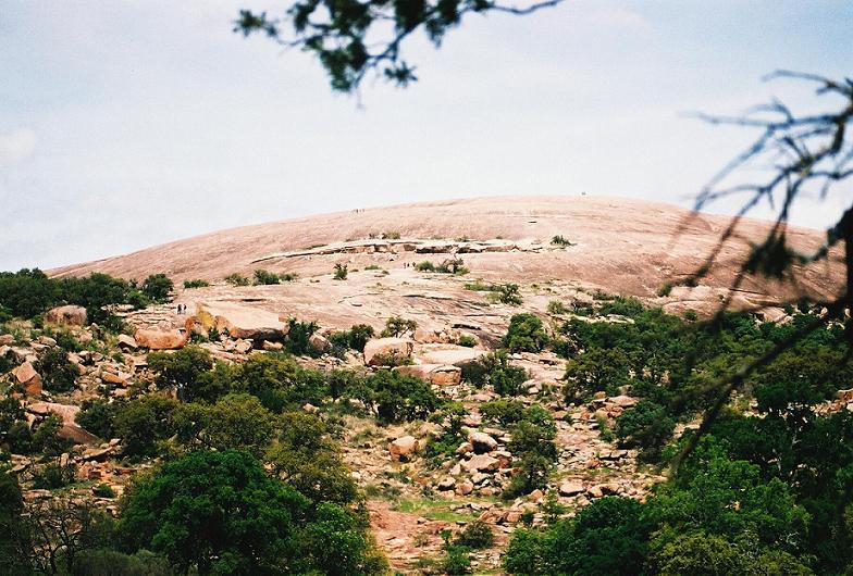 Enchanted Rock. Huge pink granite dome in Texas Hill Country. Tool finds indicate habitation near here for 10,000 years. The site was considered sacred by native people.

Photo by bat400, April 2007.