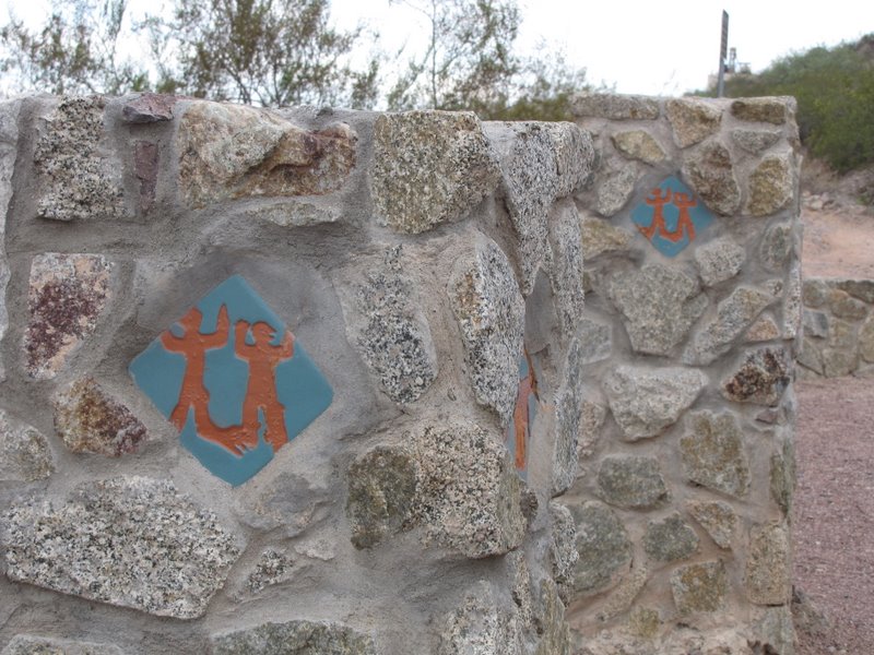 Hayden Butte (pronounced bute) has a lot of petroglyphs when you know where to look. All the glyphs are on sides of the mountain facing the sun (ie. south and east - as it seems is the case with most sites).
Most are recessed off the paths and are inaccesible due to wildlife and heritage preservation but can be viewed adequately from the paths, and with assistance (ie camera zoom, binoculars).
I