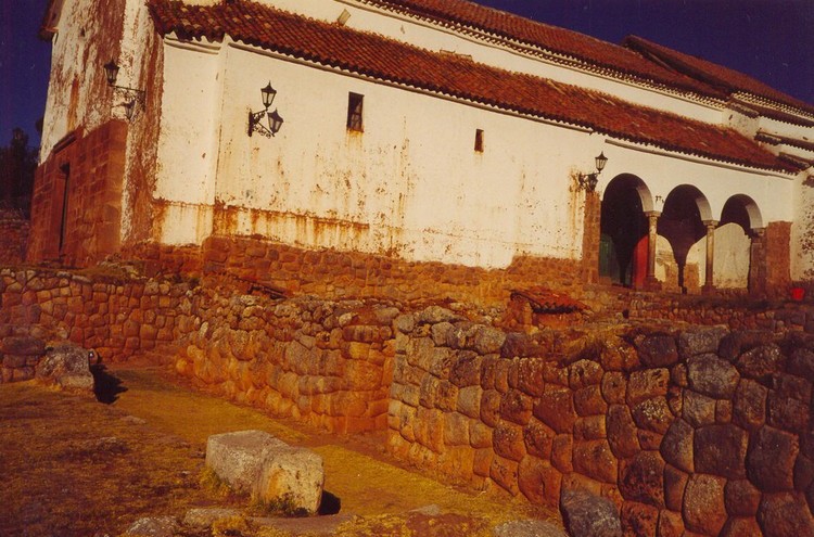 Walls from Inca period with a colonial church erected on their top (photo taken on July 2003).