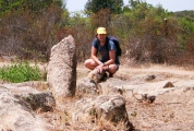 Me in front of a small menhir at Palagiu alignment in Corsica, 2003.