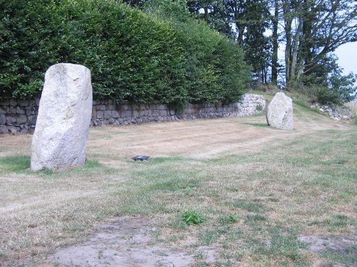 These stones are approx 150m to the E of the Kirkyard and stand in front of a house, just off the road. I cannot find any record of them being prehistoric, but they have the look of circle stones. Discard, found & re-erected? A modern addition? Please lte me know if you know.