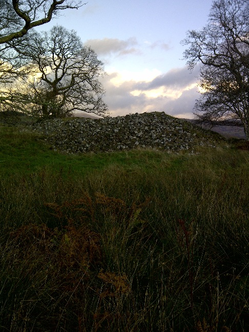 NM 922 363, Achnacree. This chambered cairn has got to be seen to be believed, like most cairns it as been robbed out with two of the chambered capstones laying on the outside to the south east with most of the spoil laying on the west side of the cairn and contributing to half its size again. This must have been a very large and impressive monument before the tomb robbers got their hand on it.
 