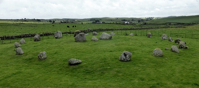 View from above and north west of the stone row standing in the centre of the stone circle.