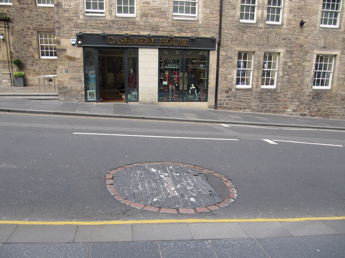 Standing on the south side of Canongate looking across the site of the old St John's Cross.