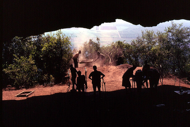 Sifting of deposits at mouth of Border Cave, near Ingwavuma, South Africa.  
Photo from excavations in the 1970s, dated 2 January 1971, by 