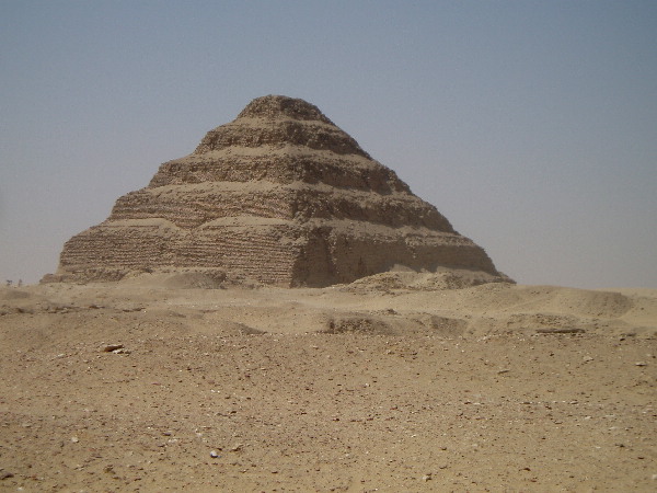 The world's first large stone structure built under Pharao Djoser founder of the 3rd Dynasty of the Old Kingdom.
Under the Architect Imhotep, the original small mastaba was expanded in all directions to a height of 62 Meters, a length of 123 Meters and a width of 107 Meters. The stone blocks are much smaller than those of the later pyramids.
The pyramid had a casing eventually, though this is no