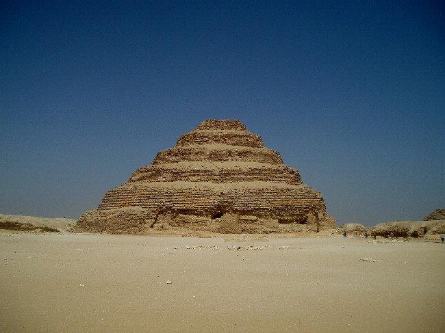 The world's first large stone structure built under Pharaoh Djoser founder of the 3rd Dynasty of the Old Kingdom.
Under the Architect Imhotep, the original small mastaba was expanded in all directions to a height of 62 metres, a length of 123 metres and a width of 107 metres. The stone blocks are much smaller than those of the later pyramids.
The pyramid had a casing eventually, though this is n