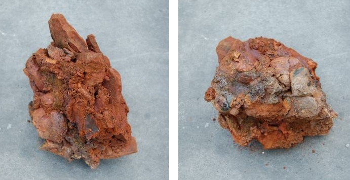 A piece of vitrified material / flow slag, dimensions c. 15X10x10 cm. 

It looks likely that this material was brought to the hillfort as part of a 'founding' event in the building of the ramparts. 

Image credit: Bangor University