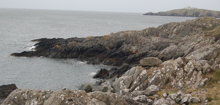 The natural erratic at Porth Newydd near Fynnon Eilian, looking eastwards towards Point Lynas.
