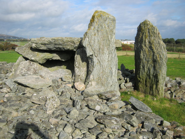 The two massive portal stones at the entrance to the eastern (newest) chamber each 2 metres tall.  September 2010.