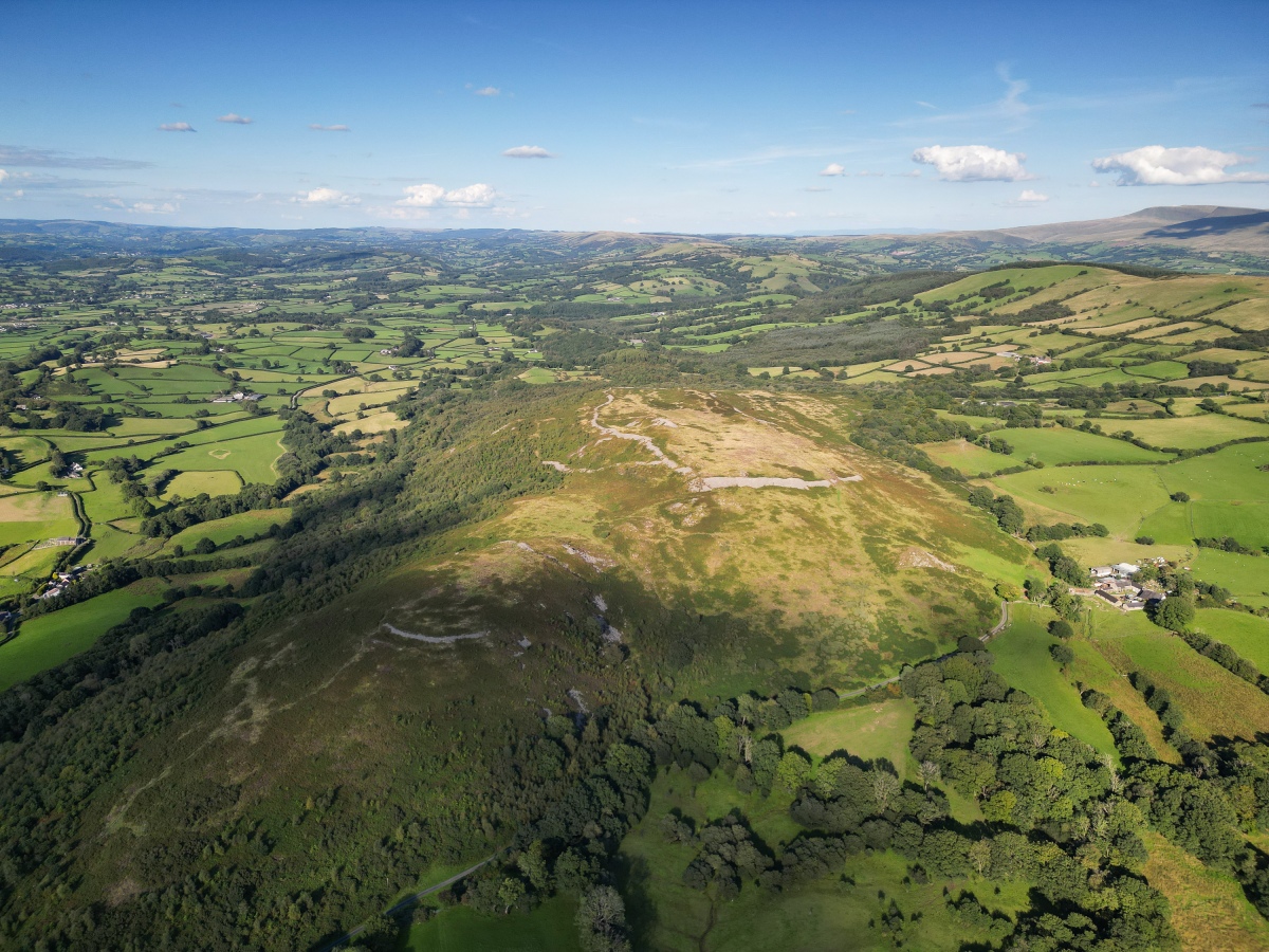 Y Carn Goch is located in the east of the Bannau Brycheiniog (Brecon Beacons) and lies four miles east of Llandeilo on the southern side of the Towy valley.  The name means 'red cairn' due to the colour of the fern covered slopes as it dies off in Autumn.  It is commonly known as Carn Goch or Garn Coch.  This is the site of one of the most impressive hill forts in all of Wales, in fact it is two f