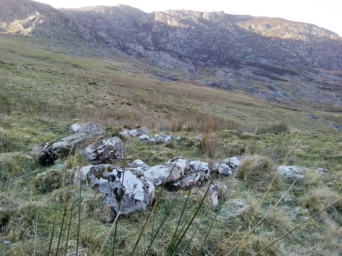 Close up of the smaller hut circle with Gallt Yr Ogof towering in the background. 