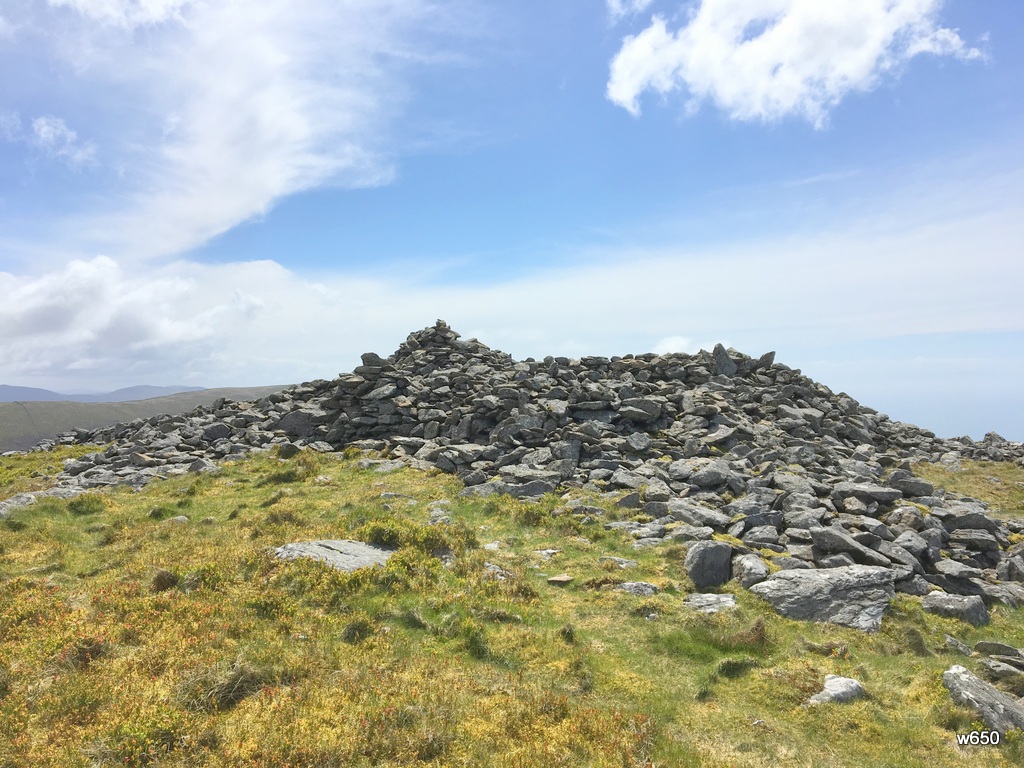 Circling around the large cairn on Moelfre, you can see that the stones have been disturbed and moved