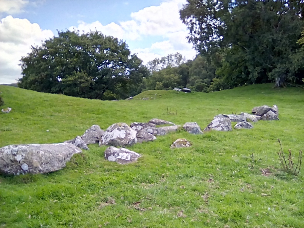 The line of large boulders with the cairn centre pic. 