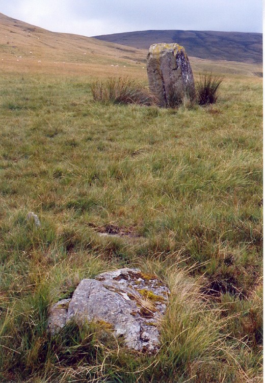 The position of the largest stone in Cerrig Duon, now fallen, in relation to Maen Mawr.  It stood in the NE arc of the circle, and most of the ritual movement in my dowse at the end of July 2005 was found in front of it.  The view up the valley is to the NW, along the pathway of a zig-zag processional way, also picked up by dowsing.  Its limit was at a tiny black dot on the edge of the lighter hil